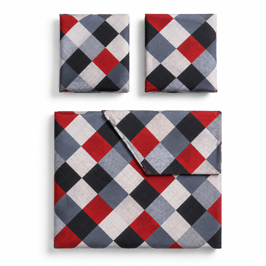Three folded textile pieces with a repeating argyle-style diamond pattern in red, black, gray, and off-white, arranged on a light gray background. A larger matching set piece is shown below two smaller pieces.