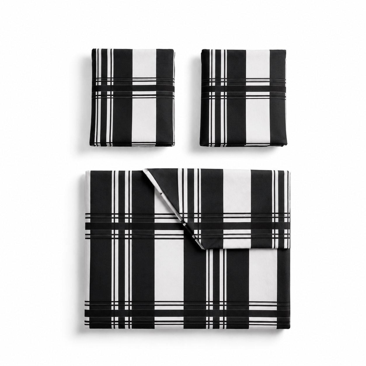 Black and white plaid bedding set on a bed in a bright bedroom.