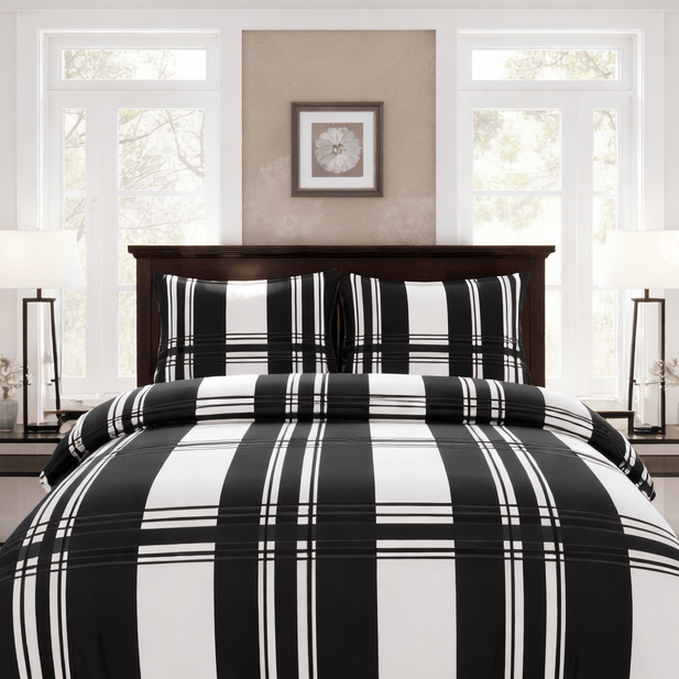 Black and white plaid bedding set on a bed in a bright bedroom.