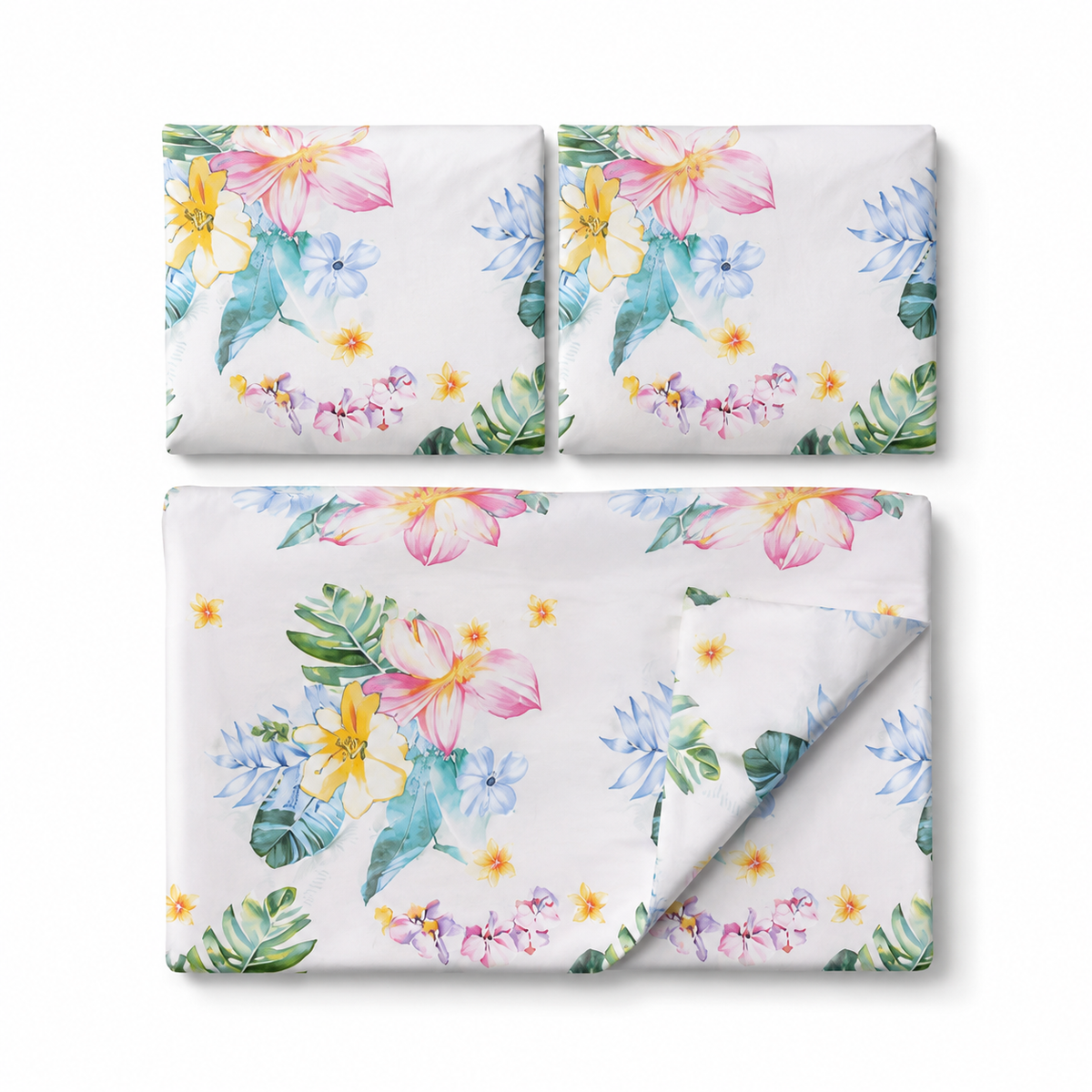 A bedding set with a tropical floral print, including a duvet cover and two pillowcases, displayed on a clean white background.