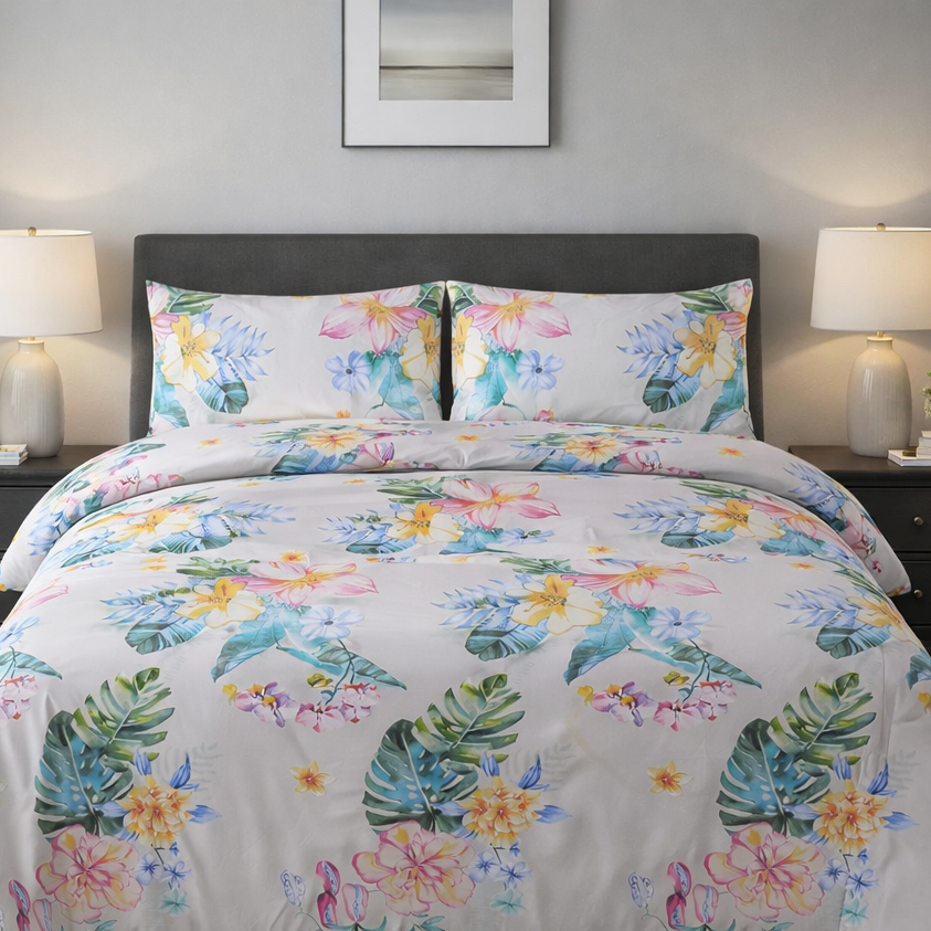 Floral comforter set on a bed in a bedroom with nightstands and lamps.