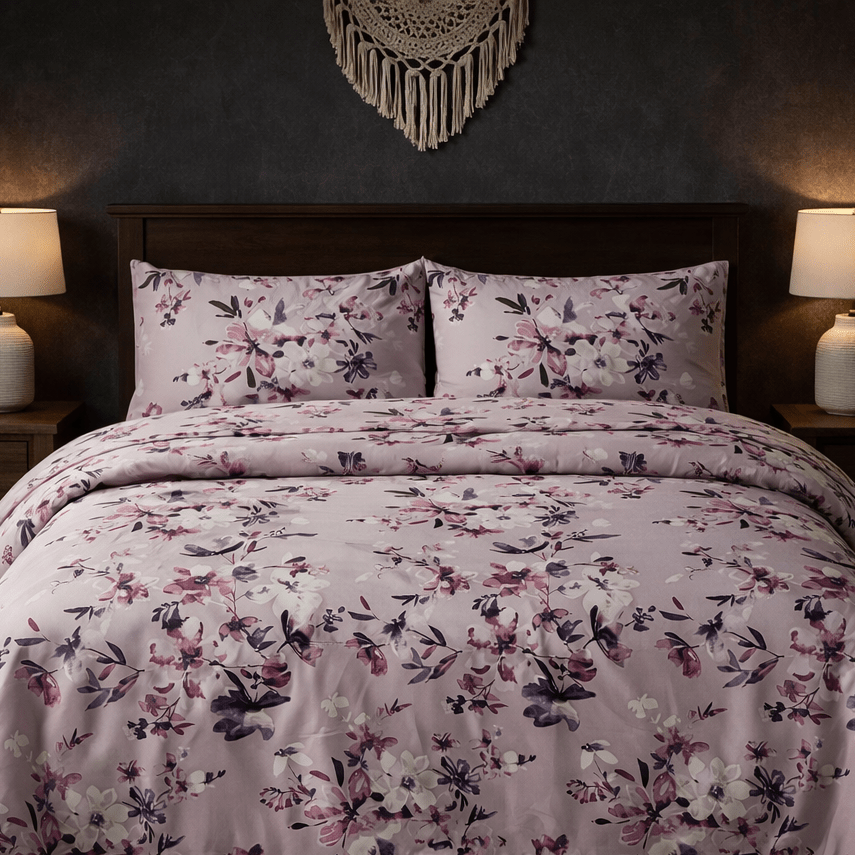 Floral patterned bedding set on a bed with matching pillows, in a bedroom setting.
