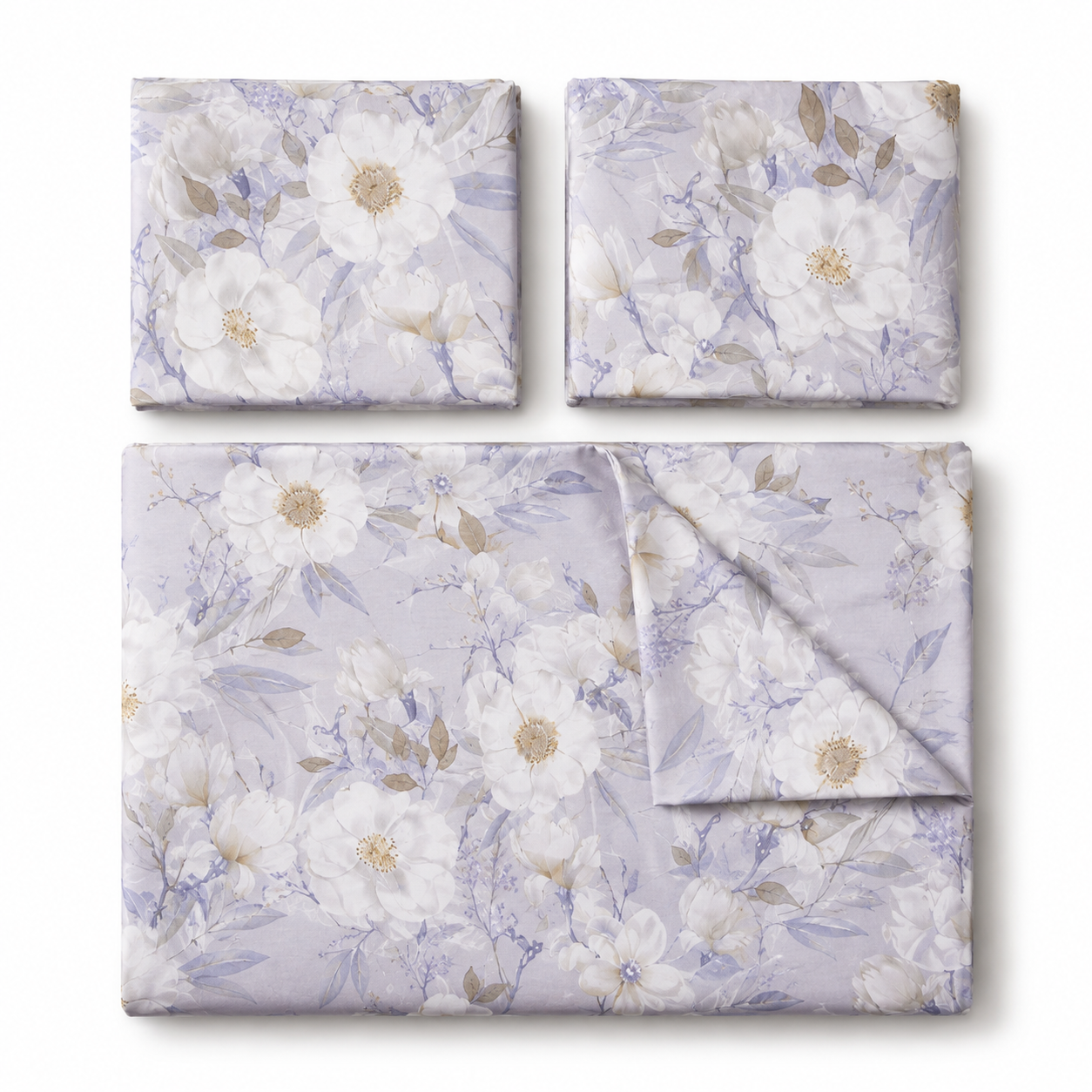 Three folded fabric pieces with a floral print in soft lavender, white, and beige are arranged on a white background. The set includes two smaller square pieces at the top and one larger rectangular piece at the bottom, with one corner folded over on the lower right.