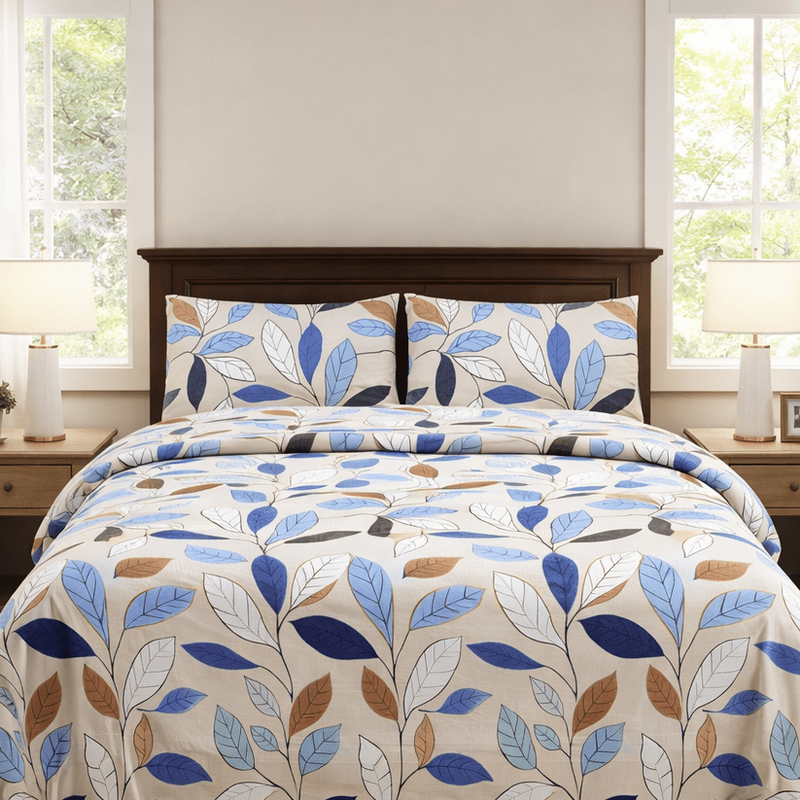 Bed with floral comforter in a bedroom setting