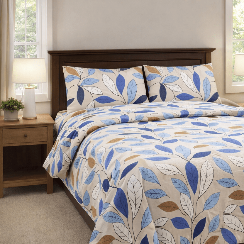 Bedroom with a bed featuring a leaf-patterned comforter, wooden headboard, and nightstands.