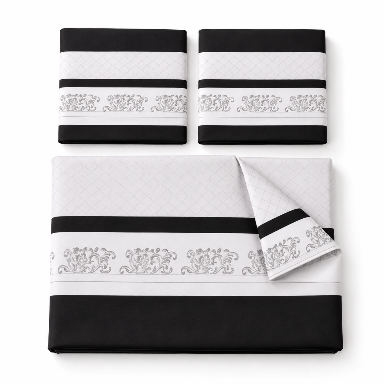 Bed with black and white bedding in a bedroom setting