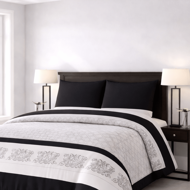 Bed with black and white bedding in a bedroom setting