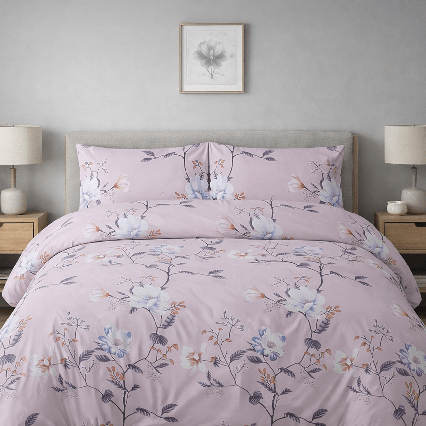 Floral bedding set on a bed in a bedroom with nightstands and lamps.