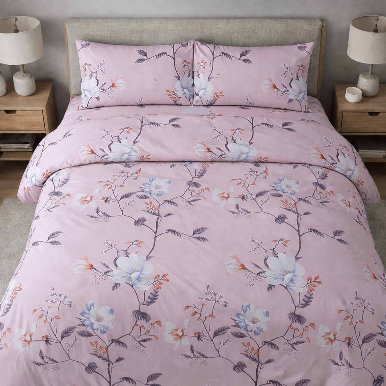 Floral patterned bedding set on a bed in a bedroom setting.