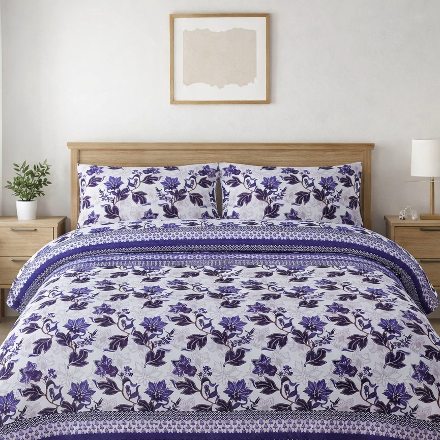 Floral patterned comforter set on a bed in a bedroom with nightstands and decor.