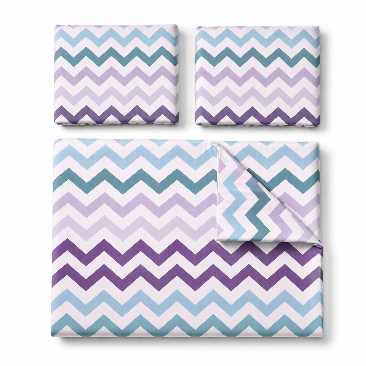 Bed with chevron patterned bedding in a bedroom setting with lamps and wall art.