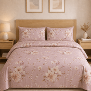 Floral patterned bedding set on a bed in a bedroom setting.