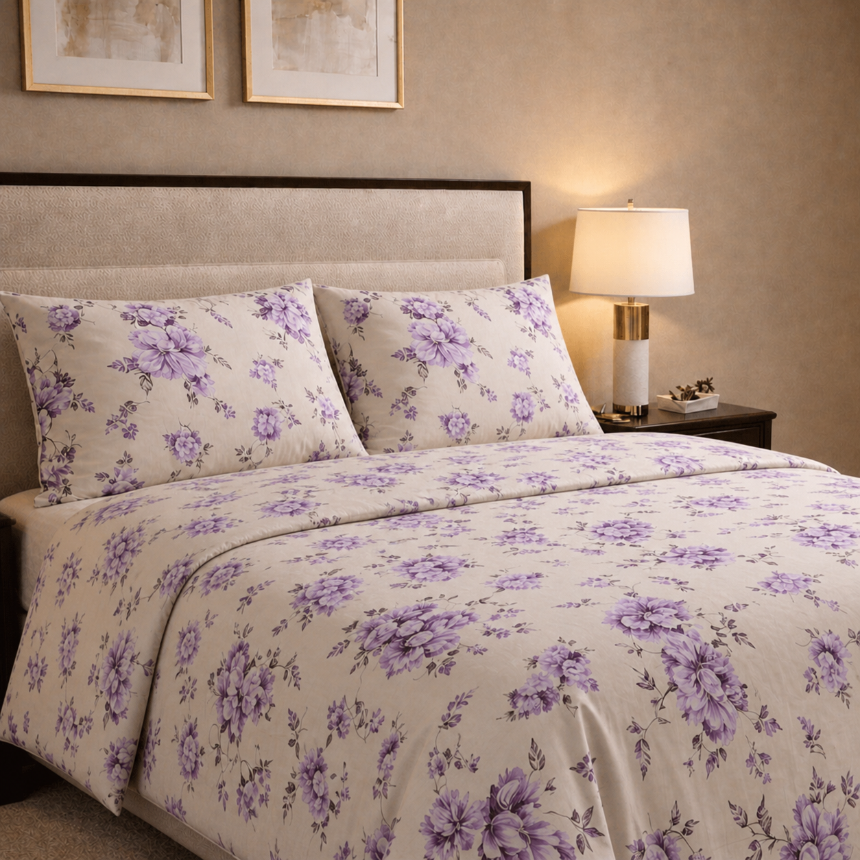 Floral bedding set with purple flowers on a bed in a bedroom setting.