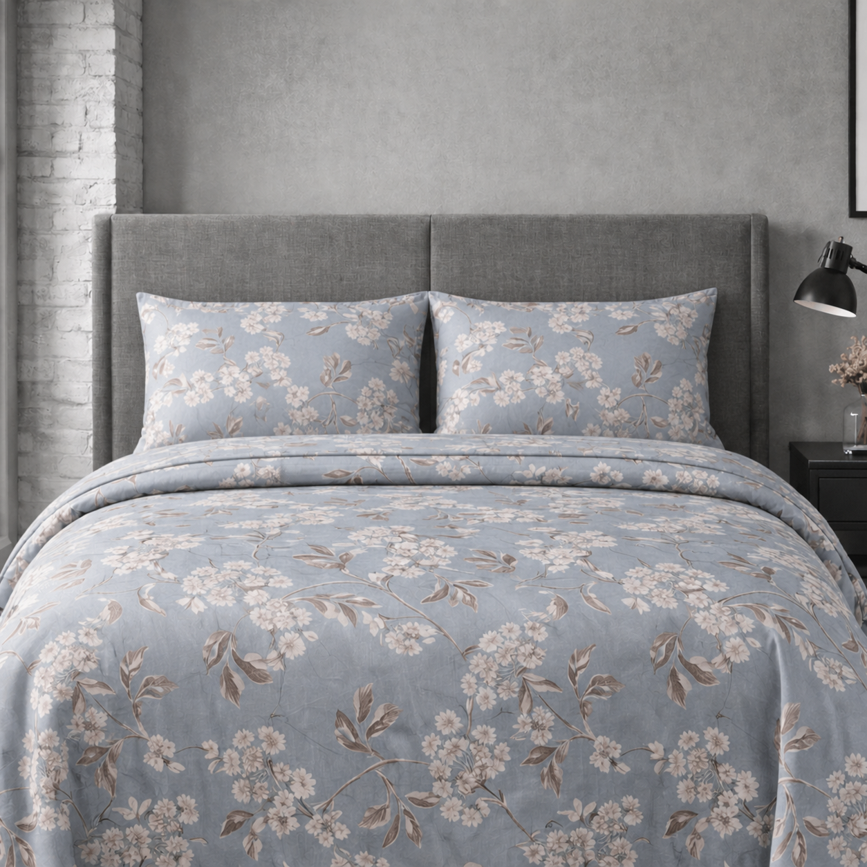 Floral patterned bedding set on a bed in a bedroom setting.