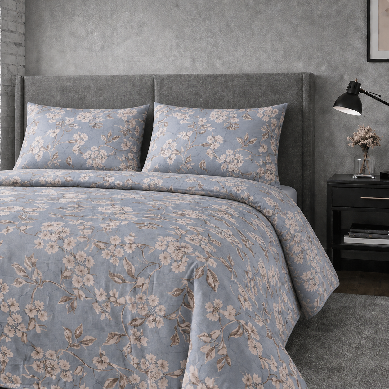 Floral patterned bedding set on a bed in a bedroom setting.