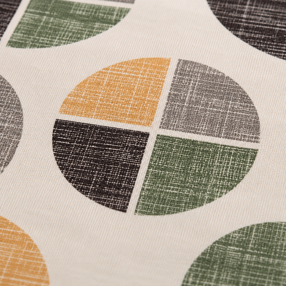 A close-up of a fabric surface with a repeating geometric pattern of partial circles on an off-white background. The visible colors in the pattern are mustard yellow, olive green, charcoal gray, and dark brown/black, with a linen-like texture.