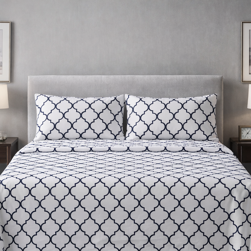Bed with patterned bedding in a bedroom setting