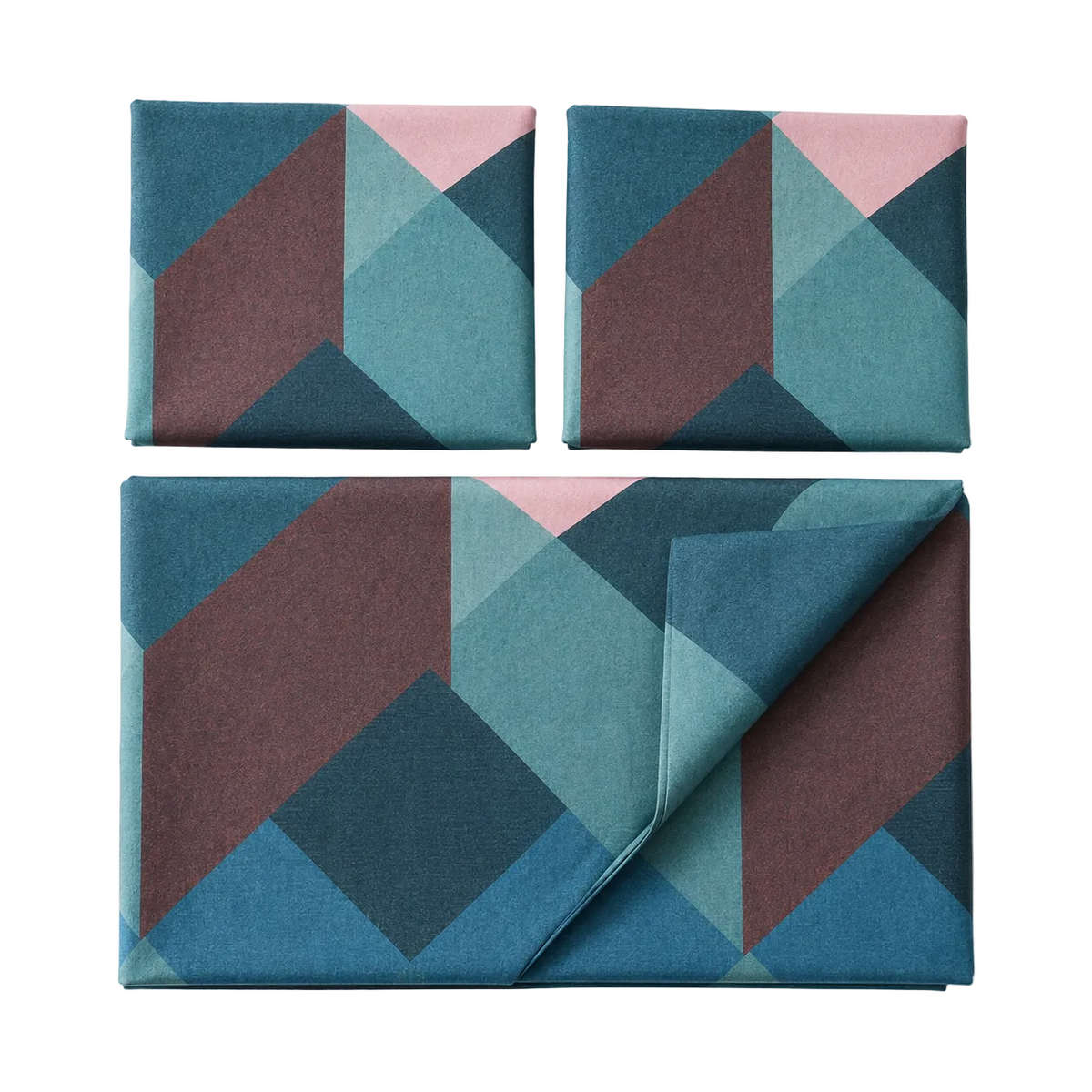 Three square fabric pieces with a geometric pattern in teal, dusty blue, burgundy, and soft pink, arranged on a white background. One larger matching fabric piece is folded over at the bottom right.
