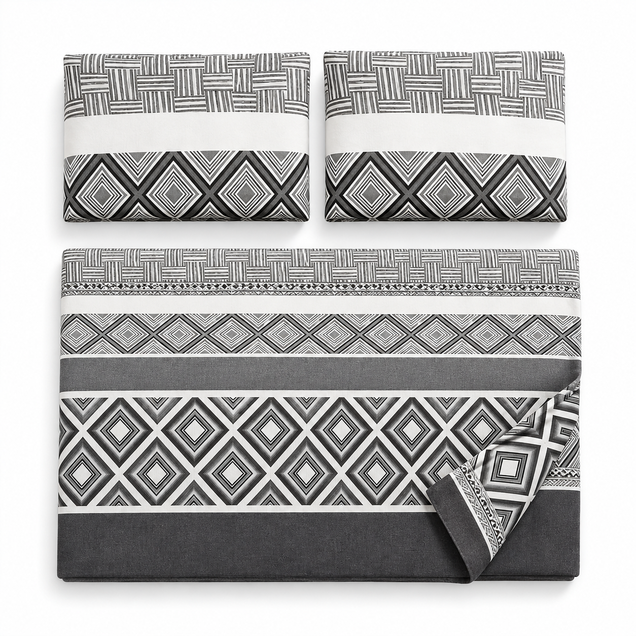 Bed with geometric patterned bedding and pillows in a bedroom setting.