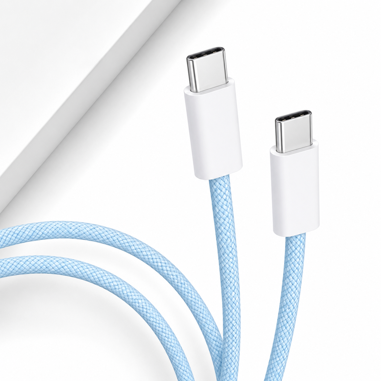 A close-up of a light blue braided USB-C to USB-C cable with white connector housings, shown on a clean white background.
